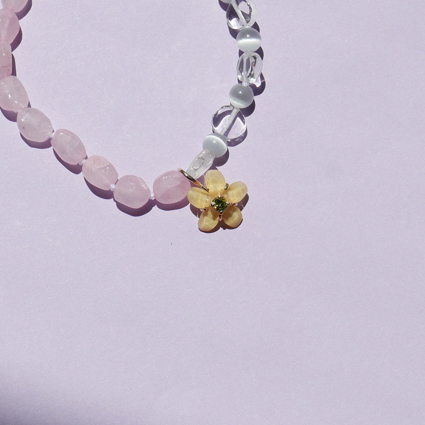 Pink Tone Bracelet with a Yellow Flower