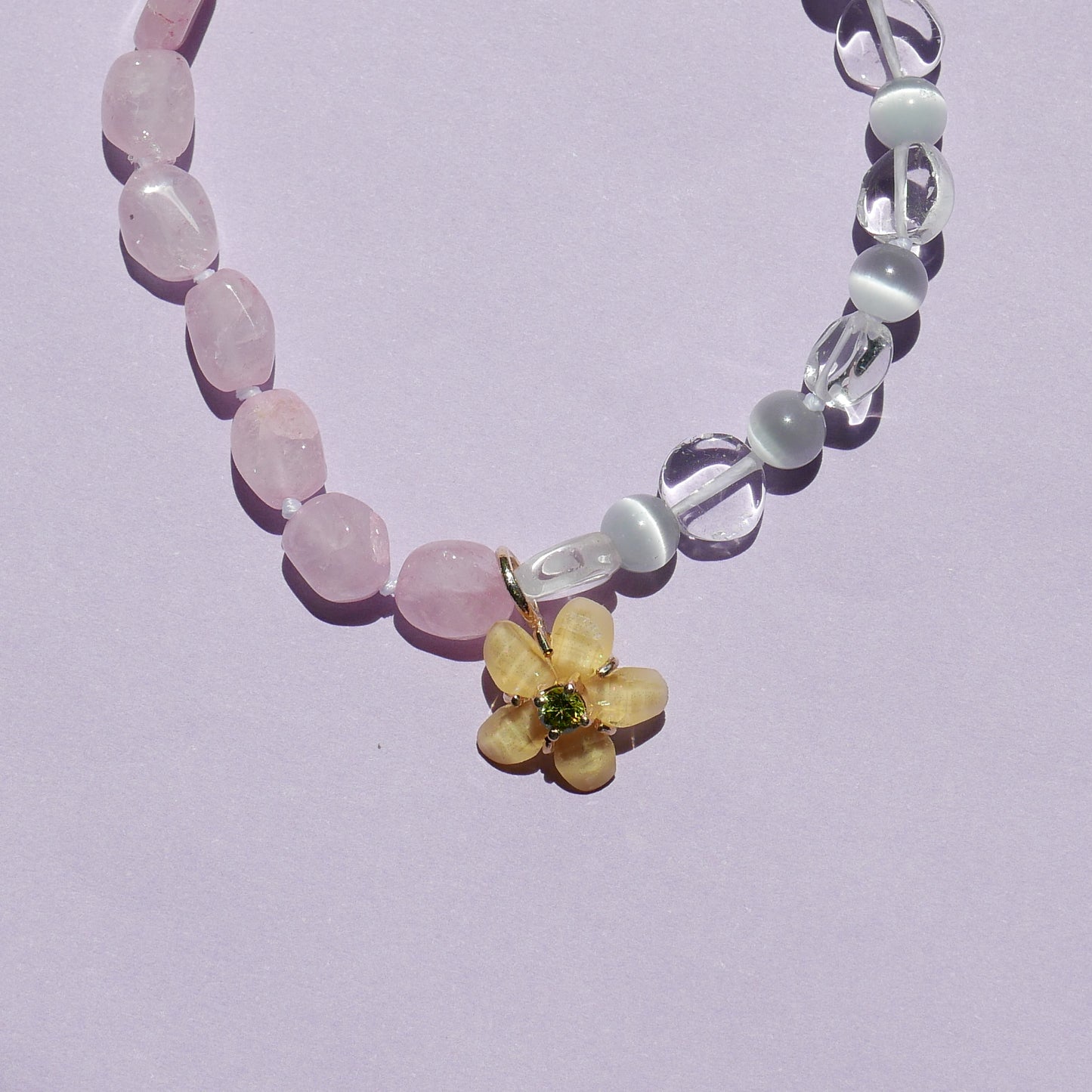 Pink Tone Bracelet with a Yellow Flower