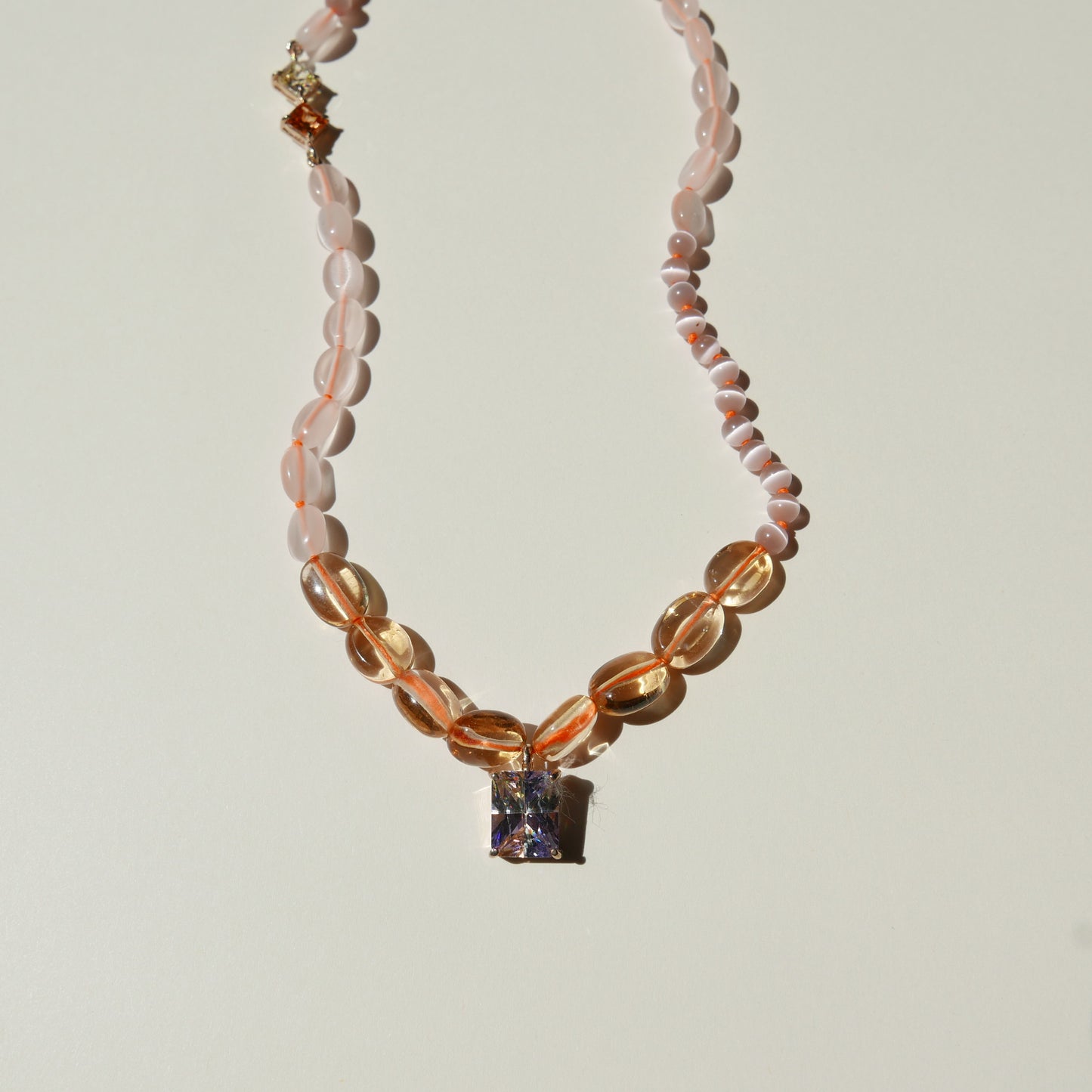 Orange Necklace with a Multi-Color Pendant