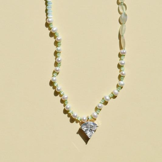 Light Green Necklace with a White Pendant