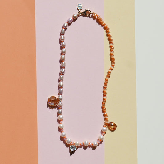 Orange Pearl Necklace with a Small Heart Pendant