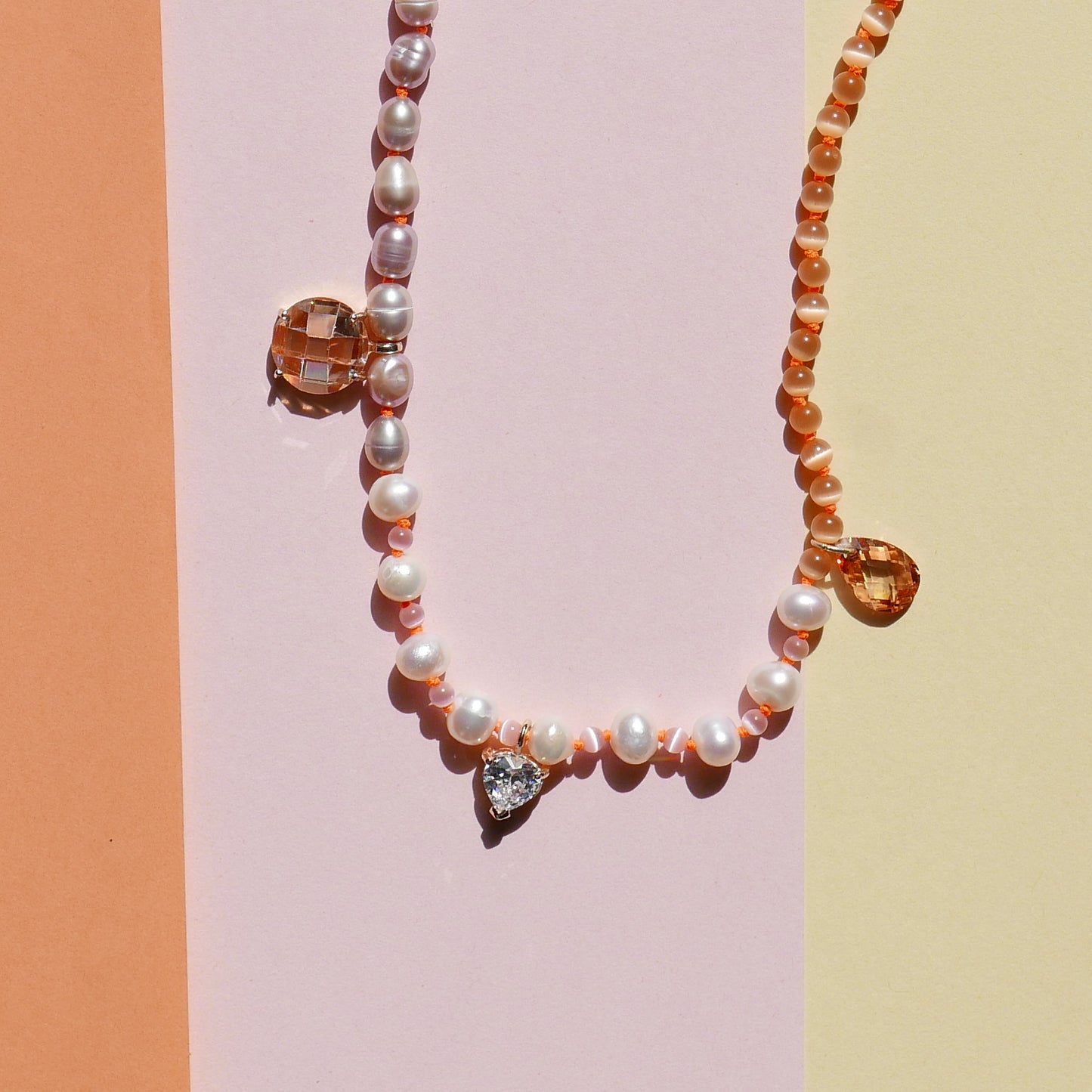 Orange Pearl Necklace with a Small Heart Pendant