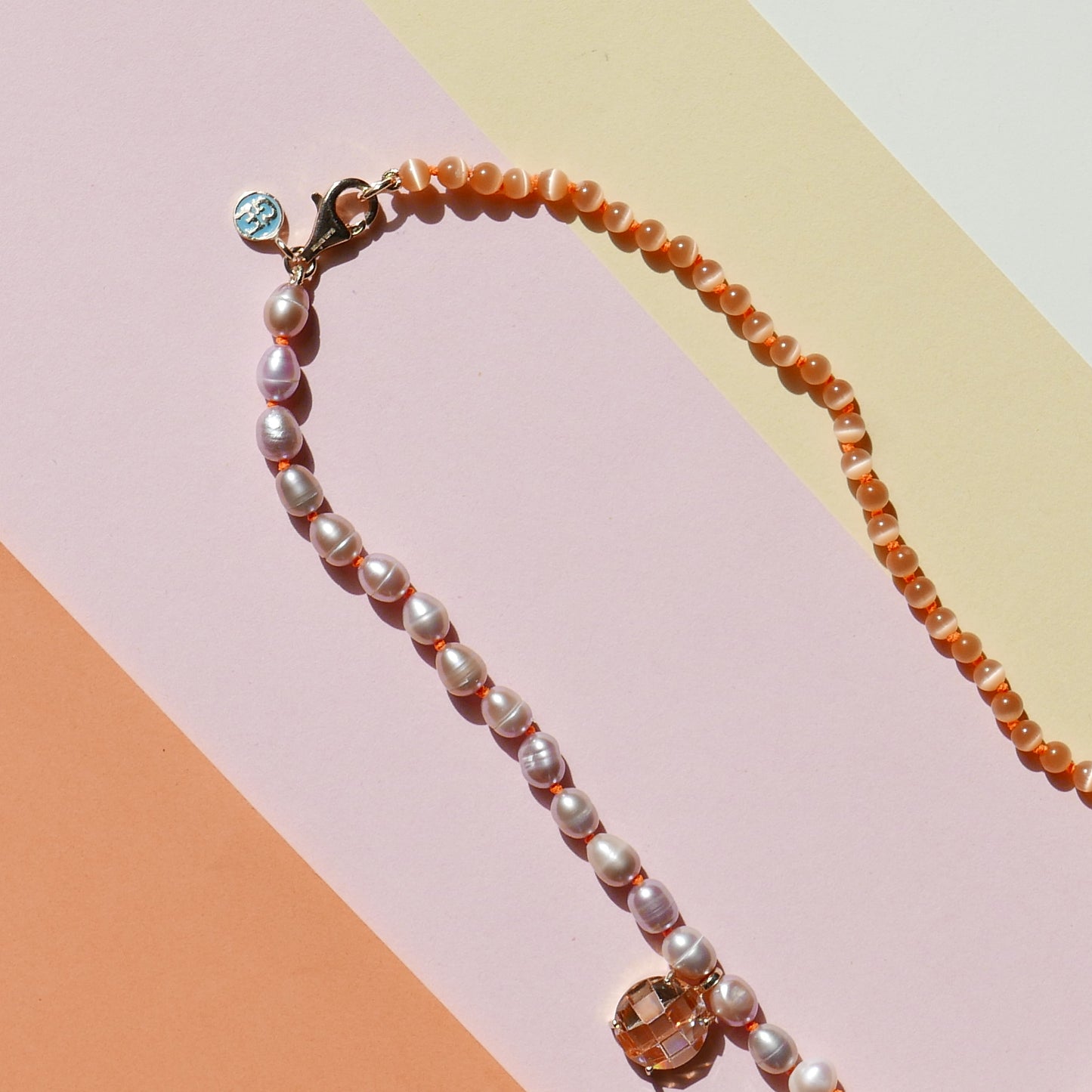 Orange Pearl Necklace with a Small Heart Pendant