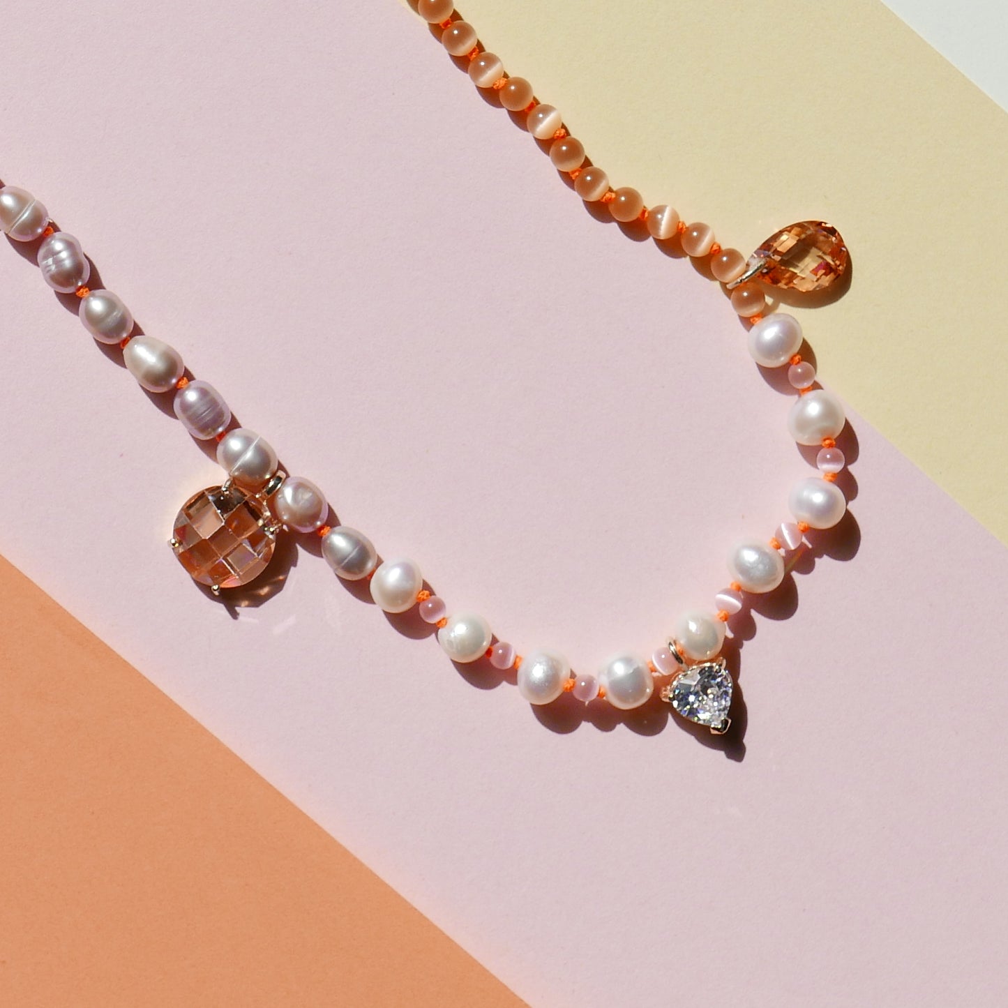 Orange Pearl Necklace with a Small Heart Pendant